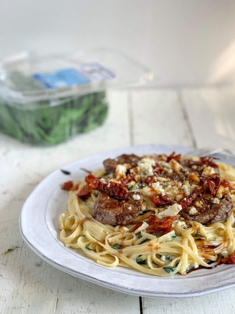 Olive Garden Steak Gorgonzola on a white plate.