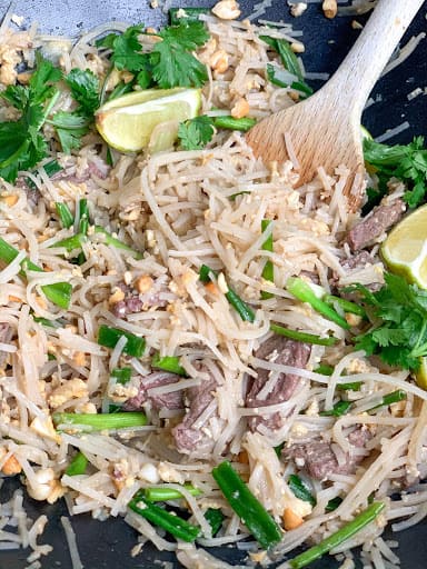 beef pad thai in a wok. 