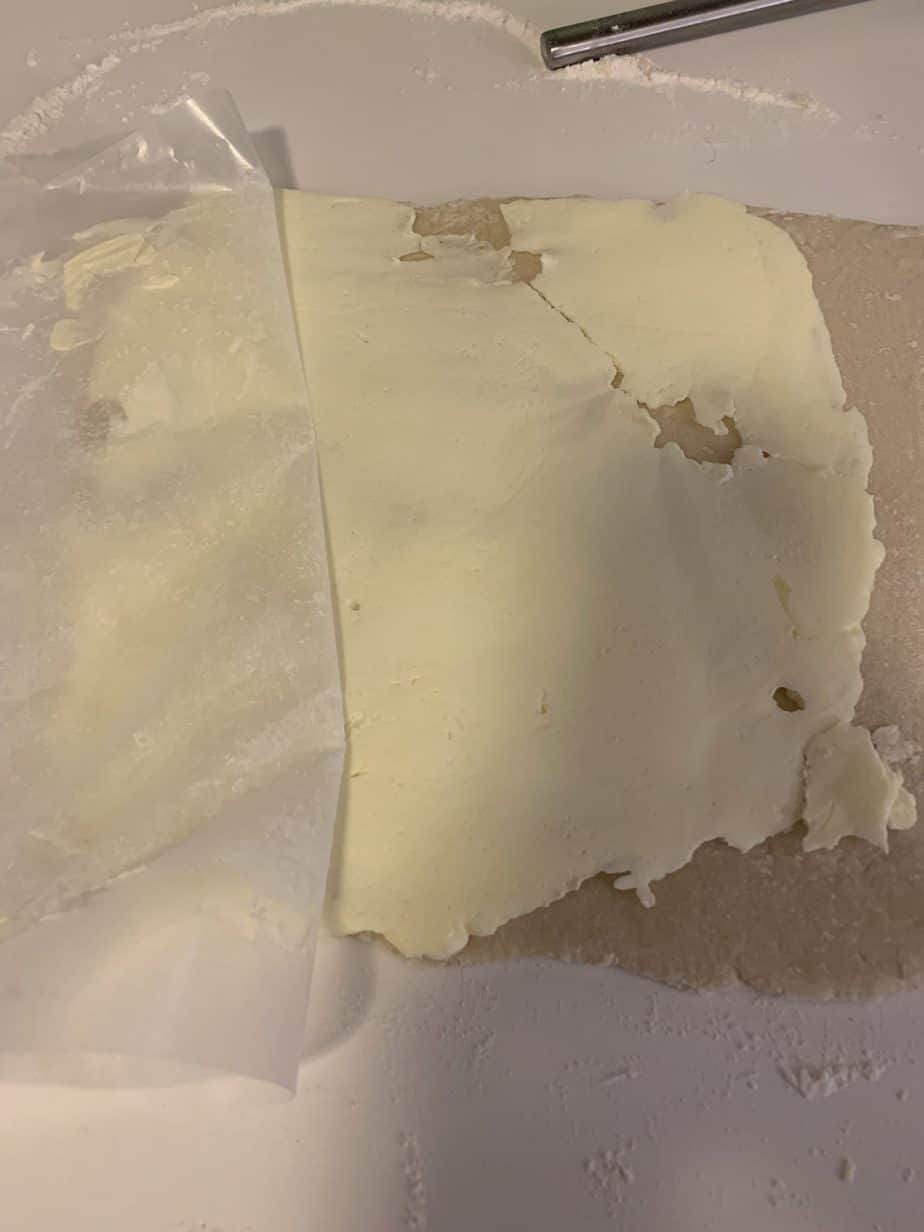 wax paper peeling back from butter sqaure
