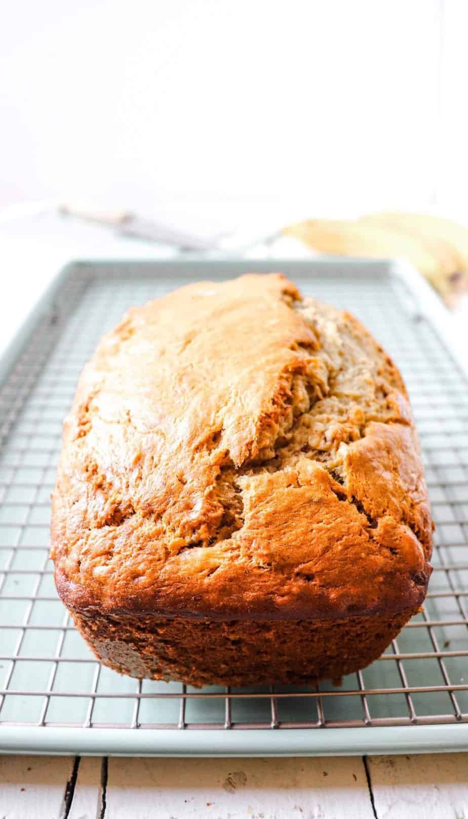 loaf of banana bread on a cooling rack.