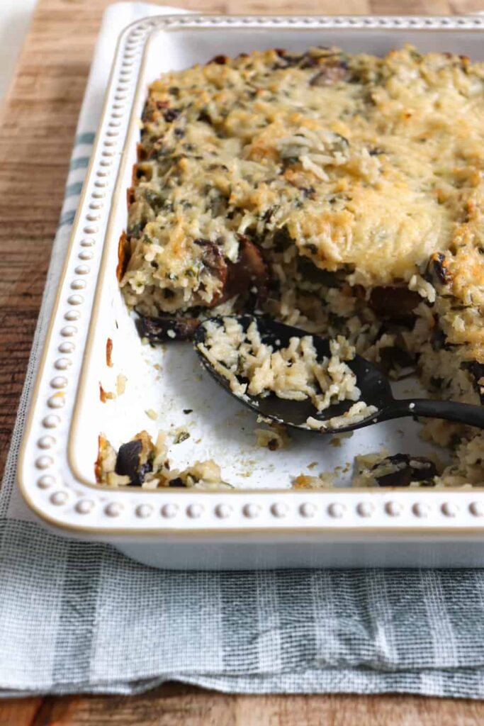 baked spinach casserole in a white dish