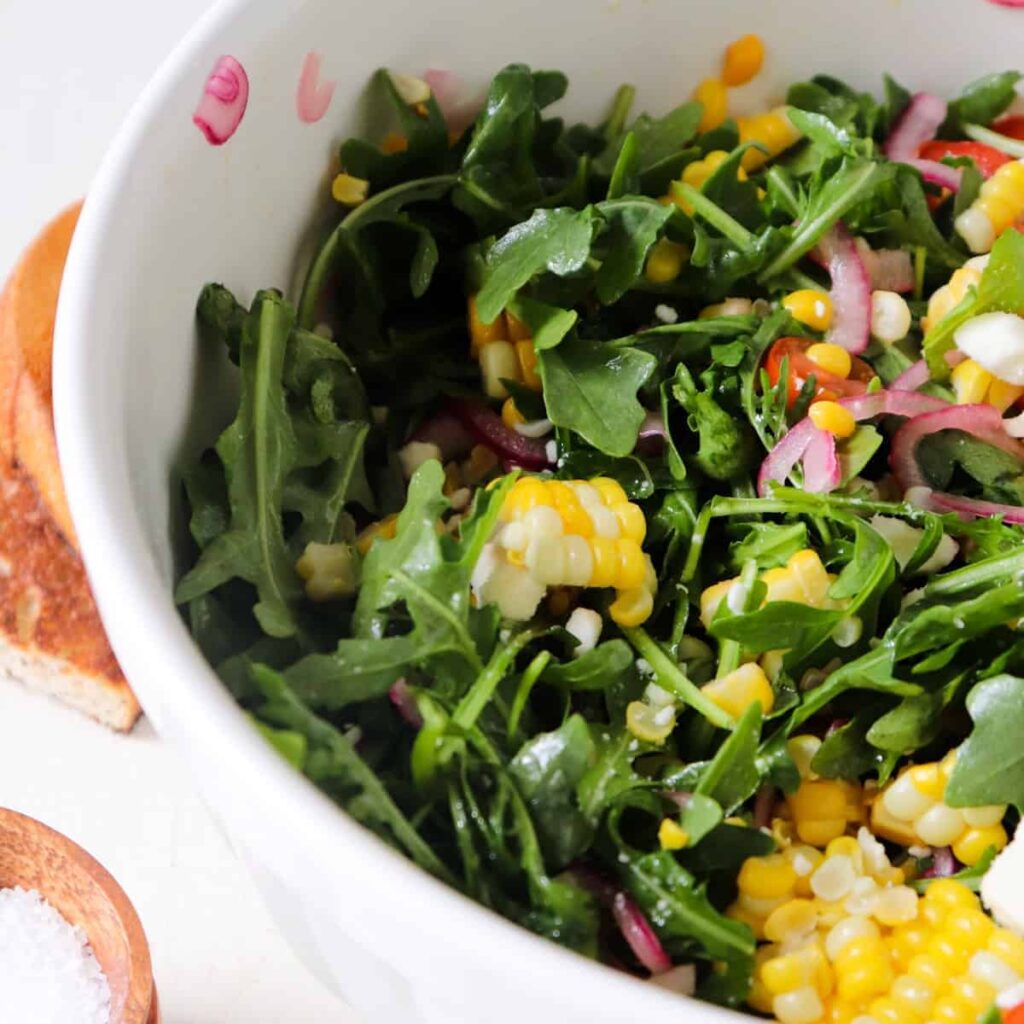 https://seasonandthyme.com/wp-content/uploads/2021/04/corn-arugula-salad-featured-1024x1024.jpg