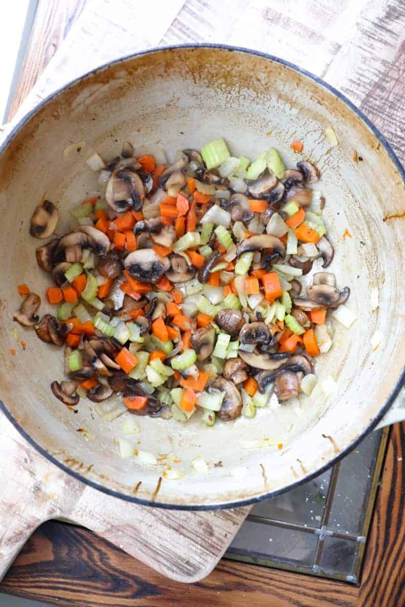 mushrooms added and sauteed in a large soup pot. 