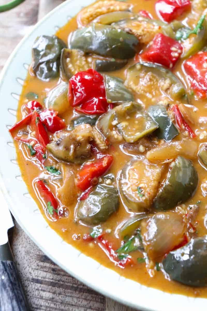 thai eggplant curry plated on a white plate.