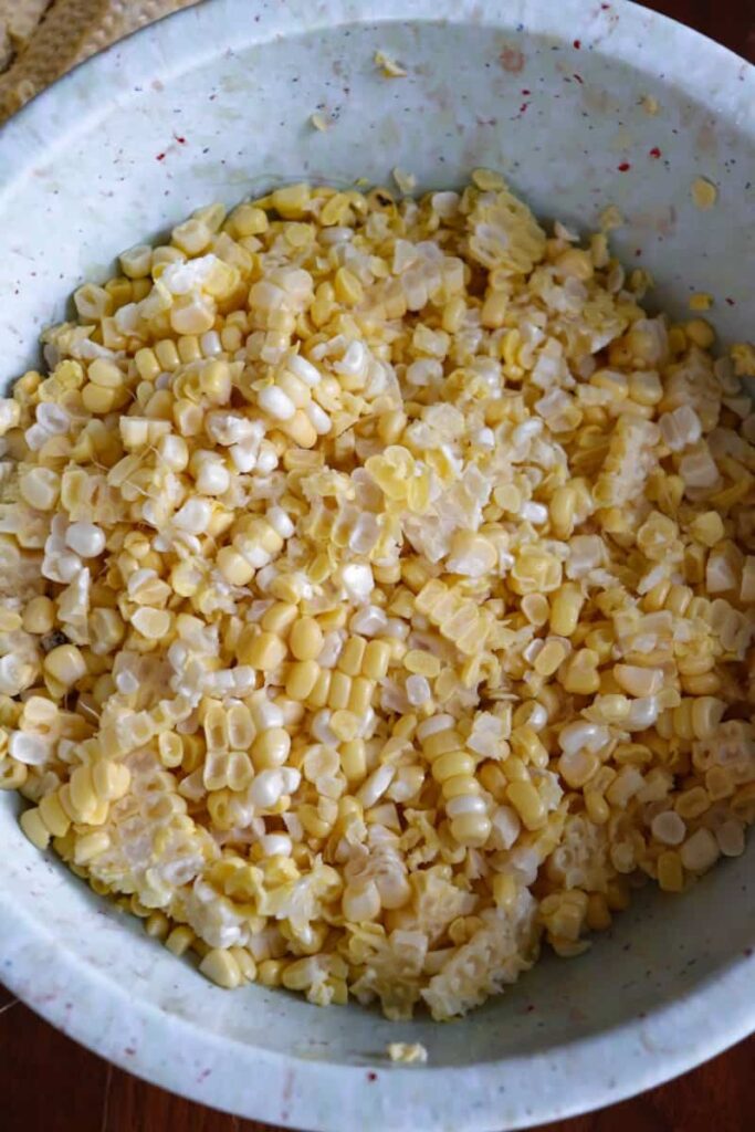 cut corn in a speckled light blue bowl