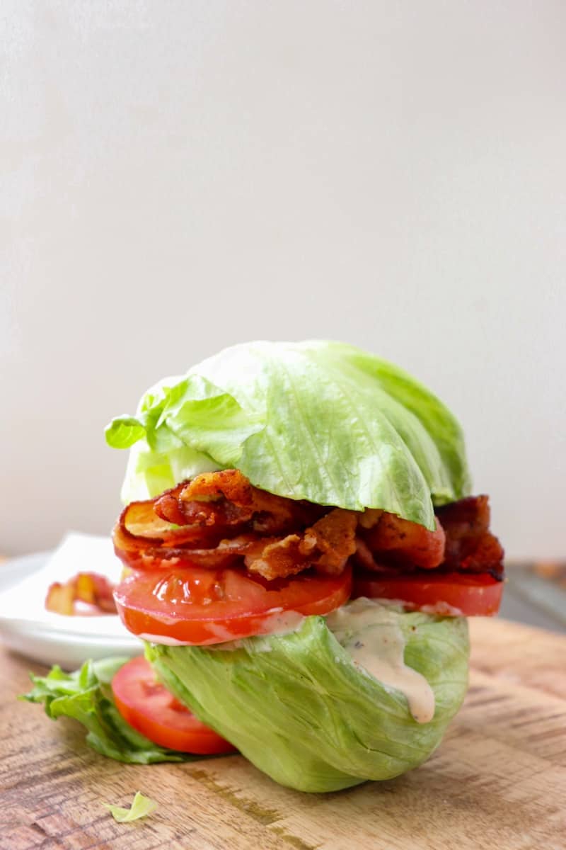 iceberg lettuce halves with ranch, tomato, and bacon inside