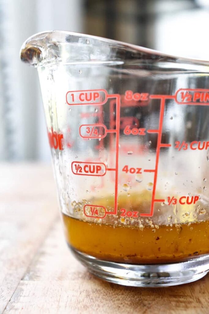 up close of glass pyrex with chicken drippings