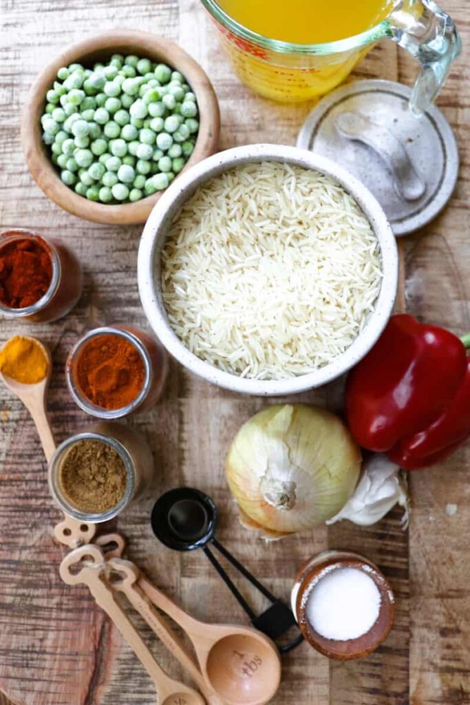spicy rice ingredients laid out on a wooden background