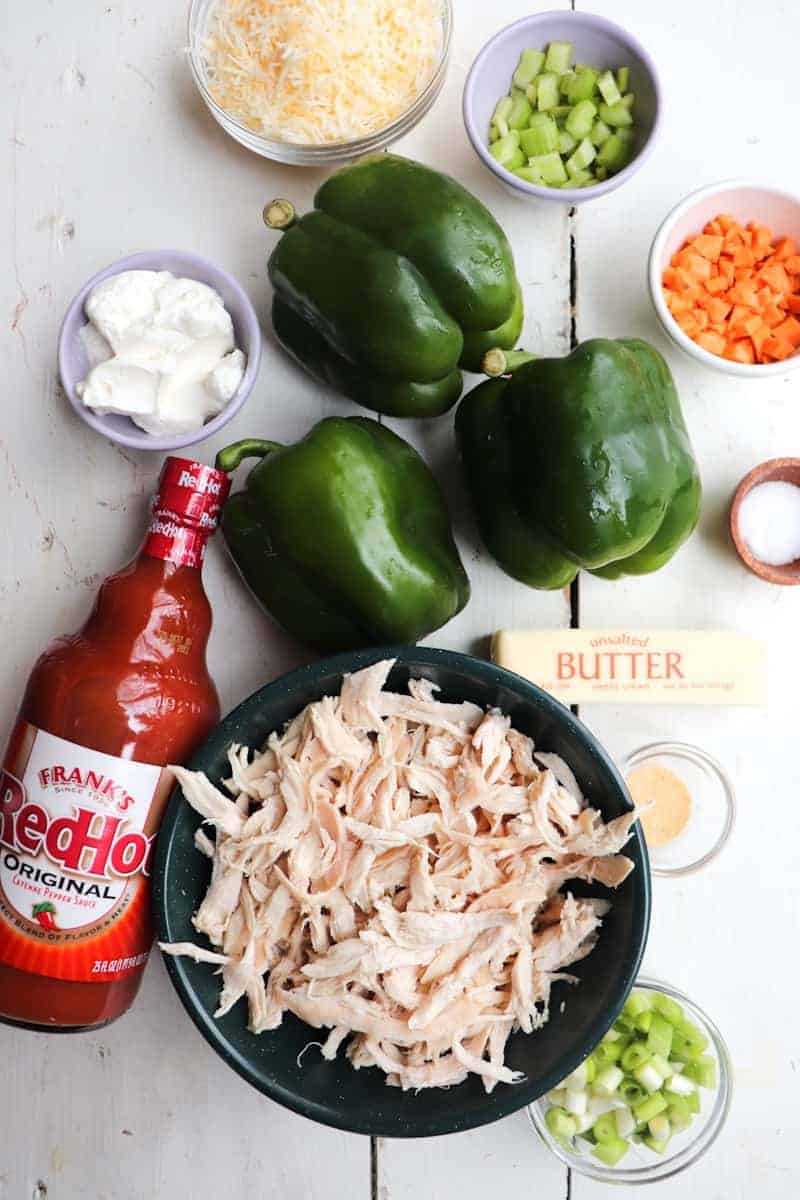ingredients for buffalo stuffed peppers on a white background 