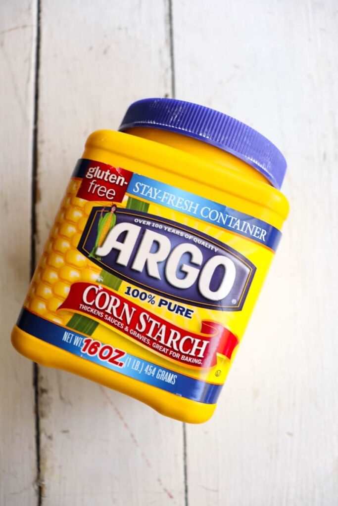 shot of argo corn starch on its side on a white background