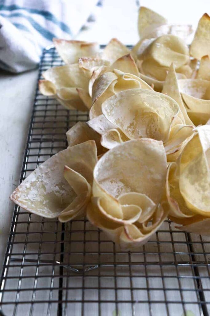 baked wonton cups on a metal cooling rack