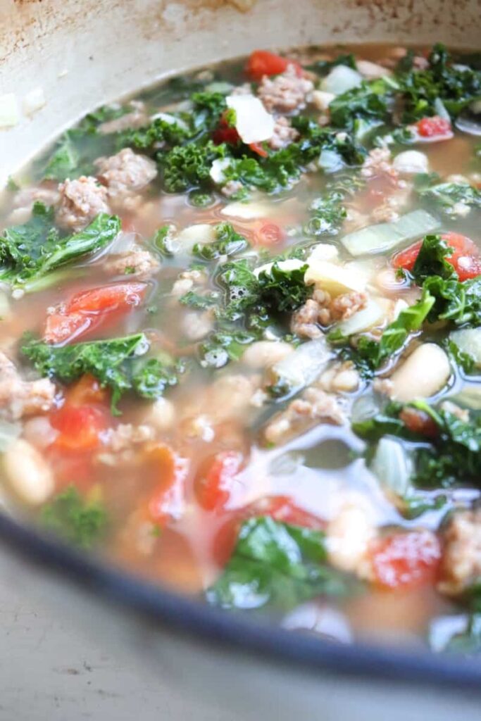 up close shot of kale soup in a big pot
