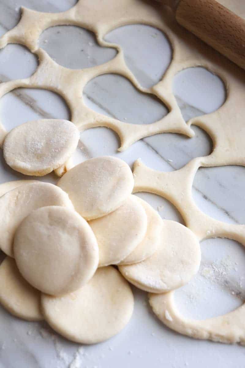 circle cut outs of kolaczki dough