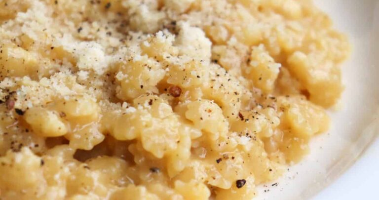 bowl of pastina topped with parmesan cheese.