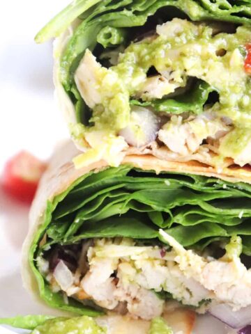 pesto chicken wrap cut in half and stacked.