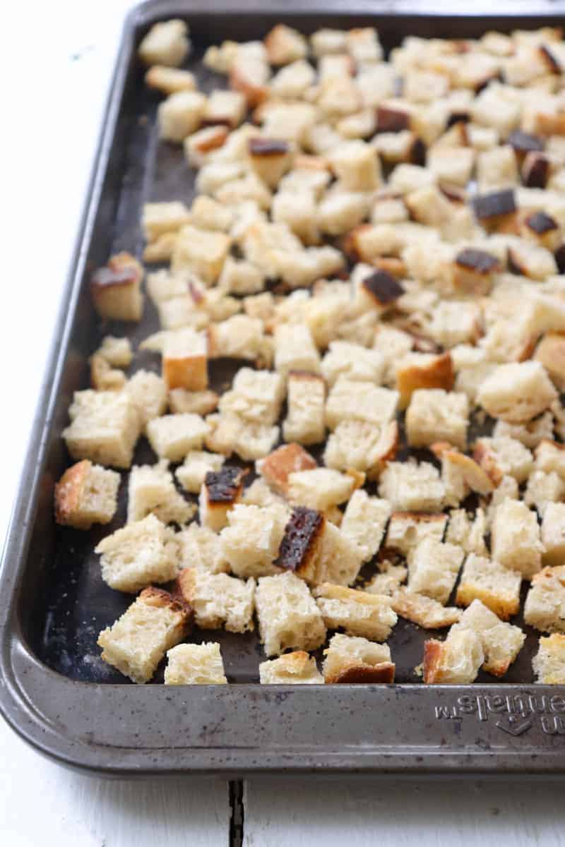 dried bread cubes on a baking sheet