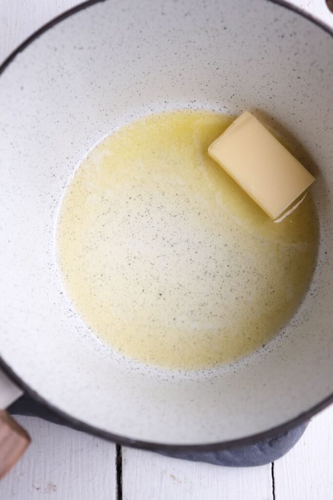 melting butter in a white pot