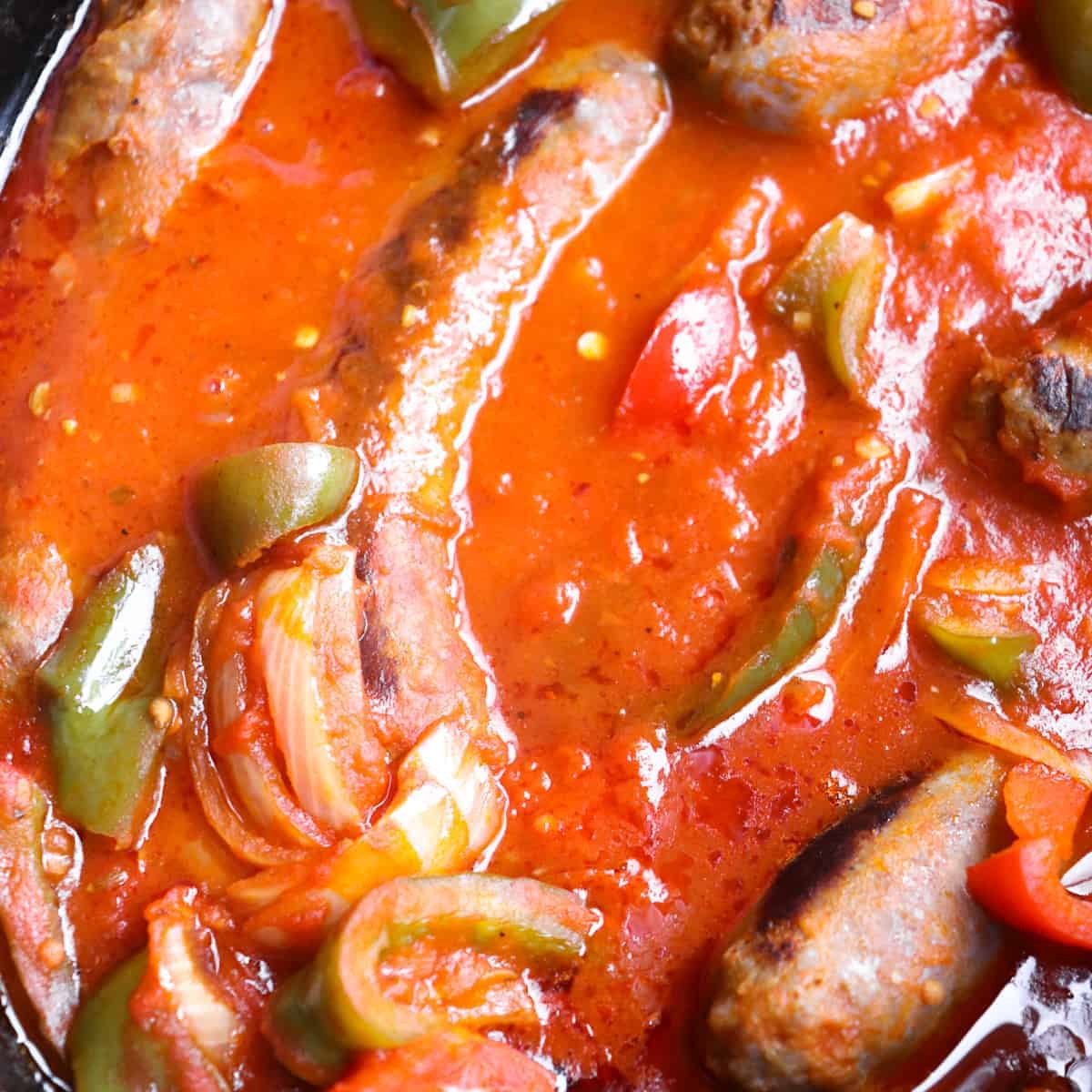upclose of sausage and peppers in the crockpot