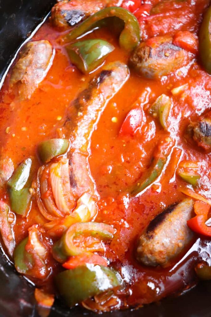 upclose of sausage and peppers in the crockpot