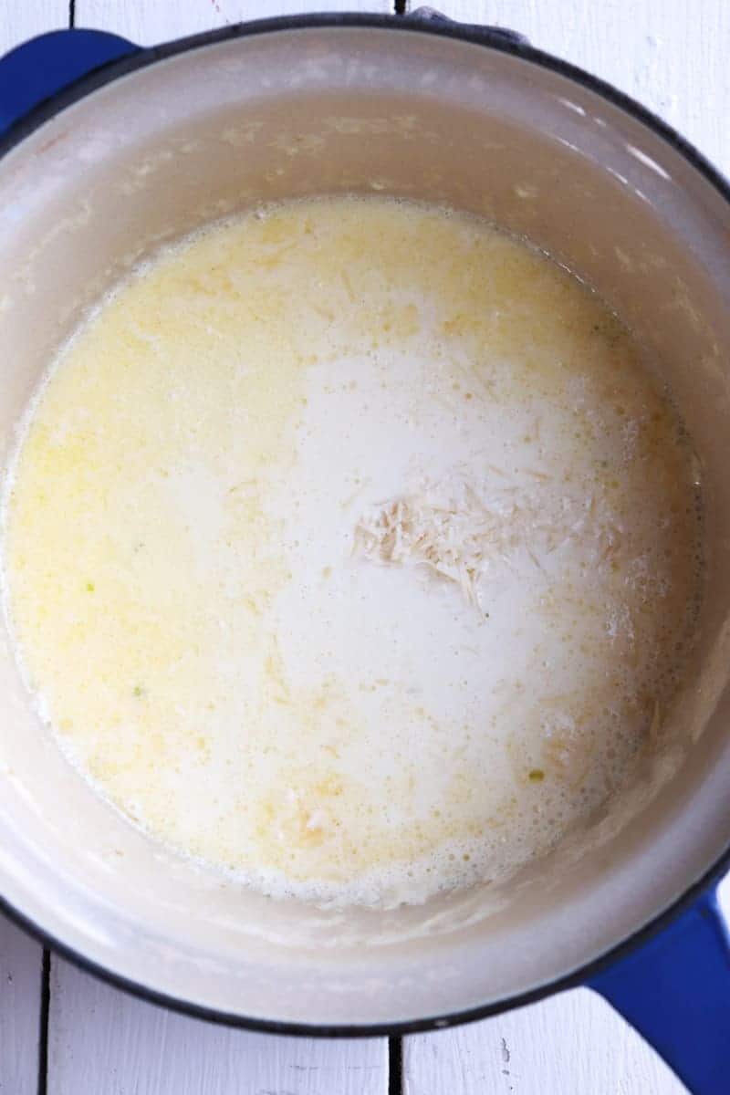 parmesan cheese added to garlic cream sauce