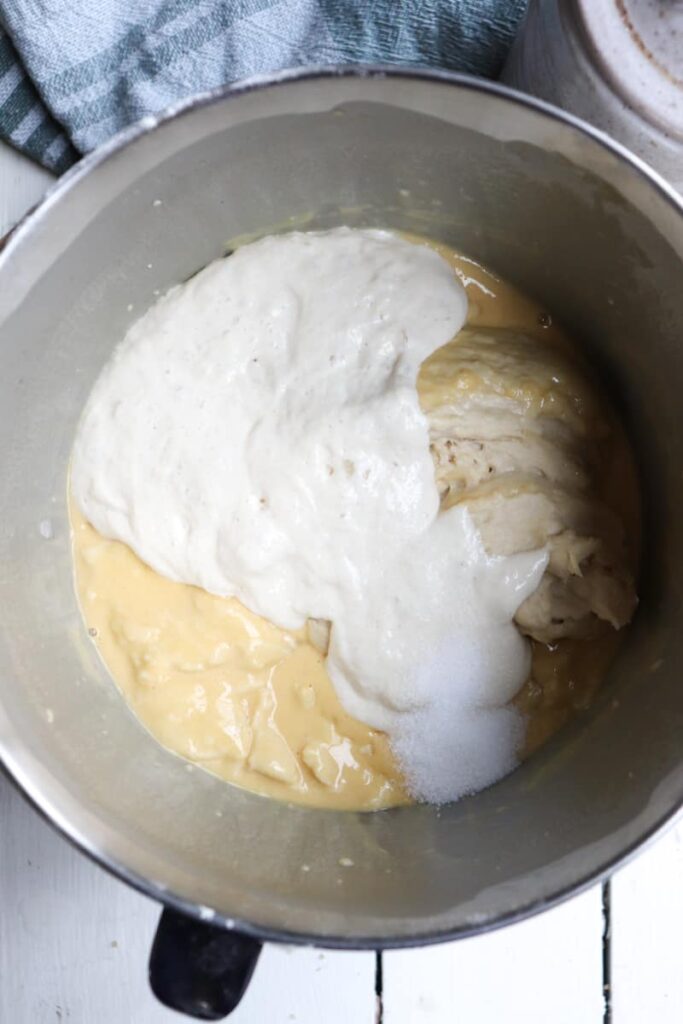 sourdough starter poured over dough