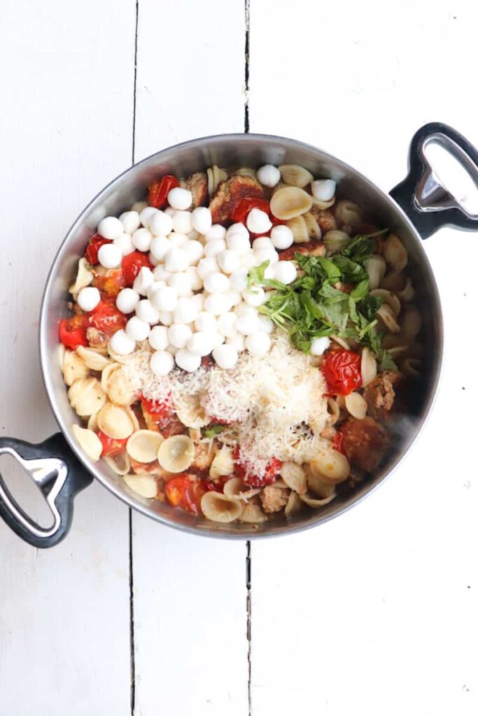 pasta dish in a large pot unmixed