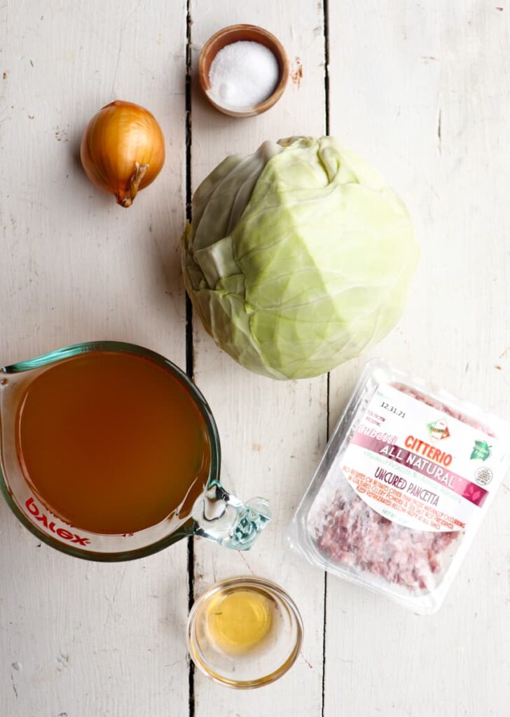 ingredients for slow cooker cabbage on a white background