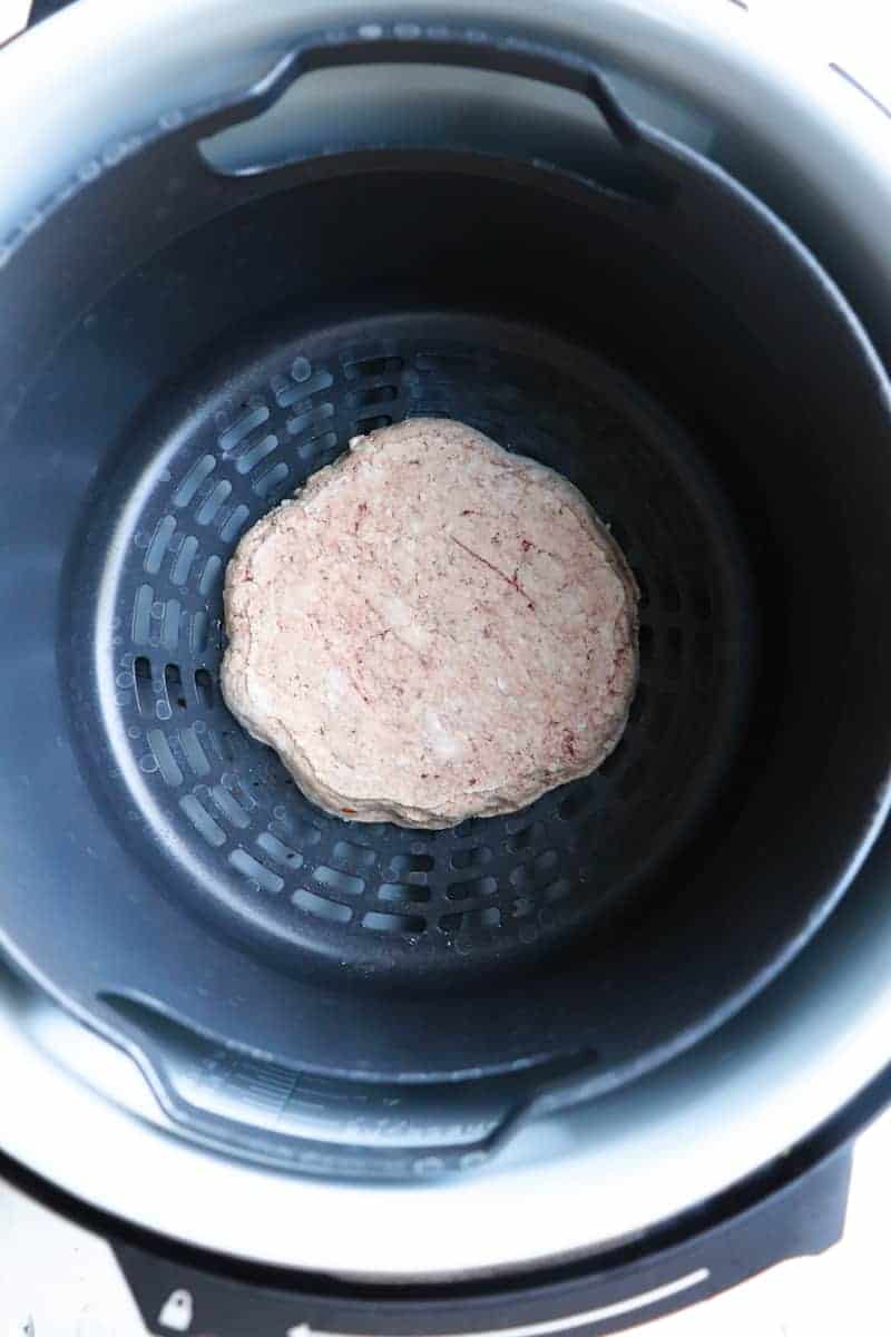 one frozen burger patty in ninja foodi basket