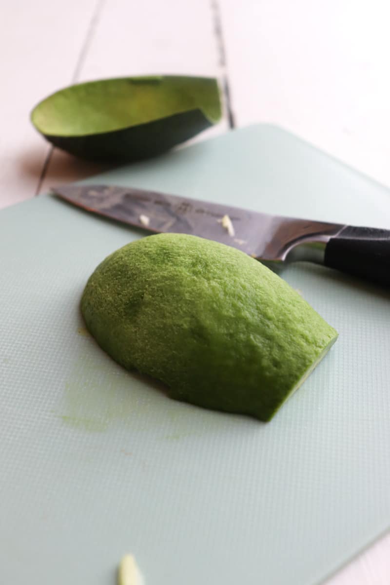 avocado sliced in half and skin removed