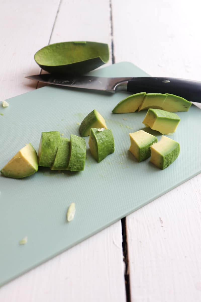 avocado being cut into chunks
