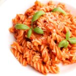 plated pasta garnished with basil