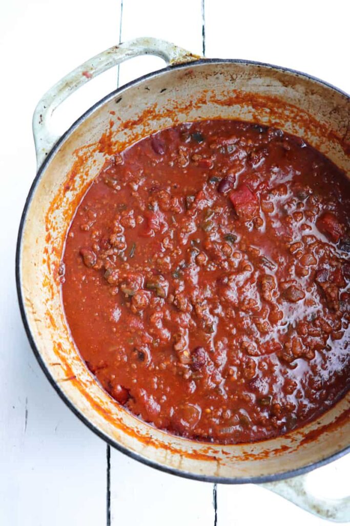 cast iron pot full of ground venison chili
