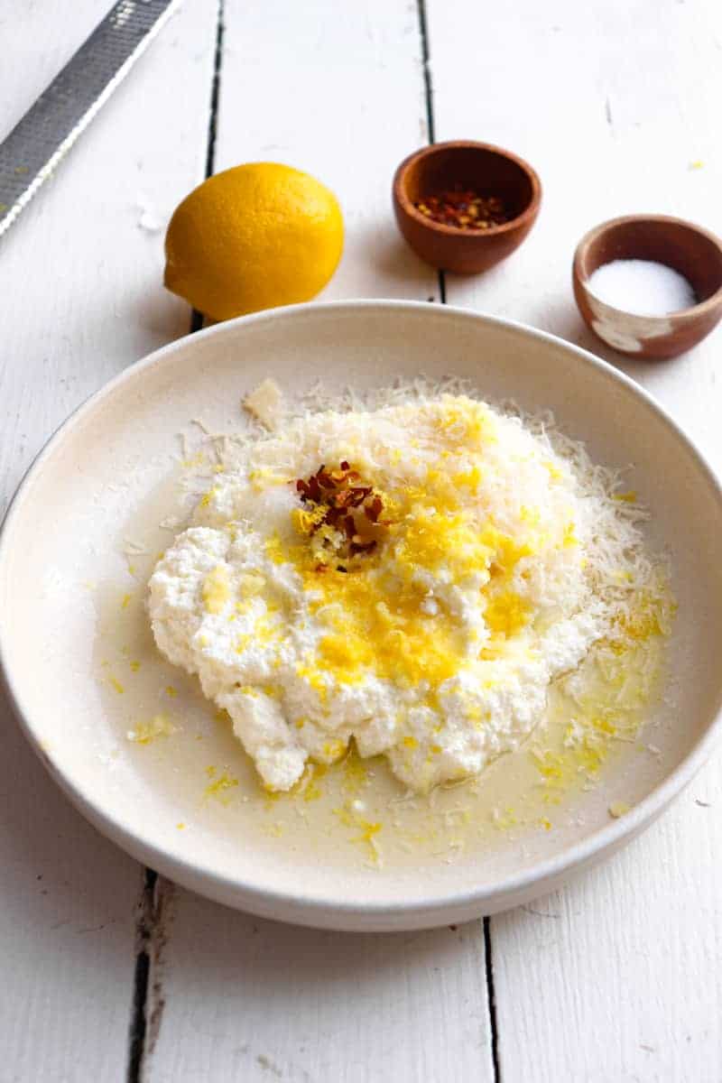 ingredients for ricotta sauce in a bowl