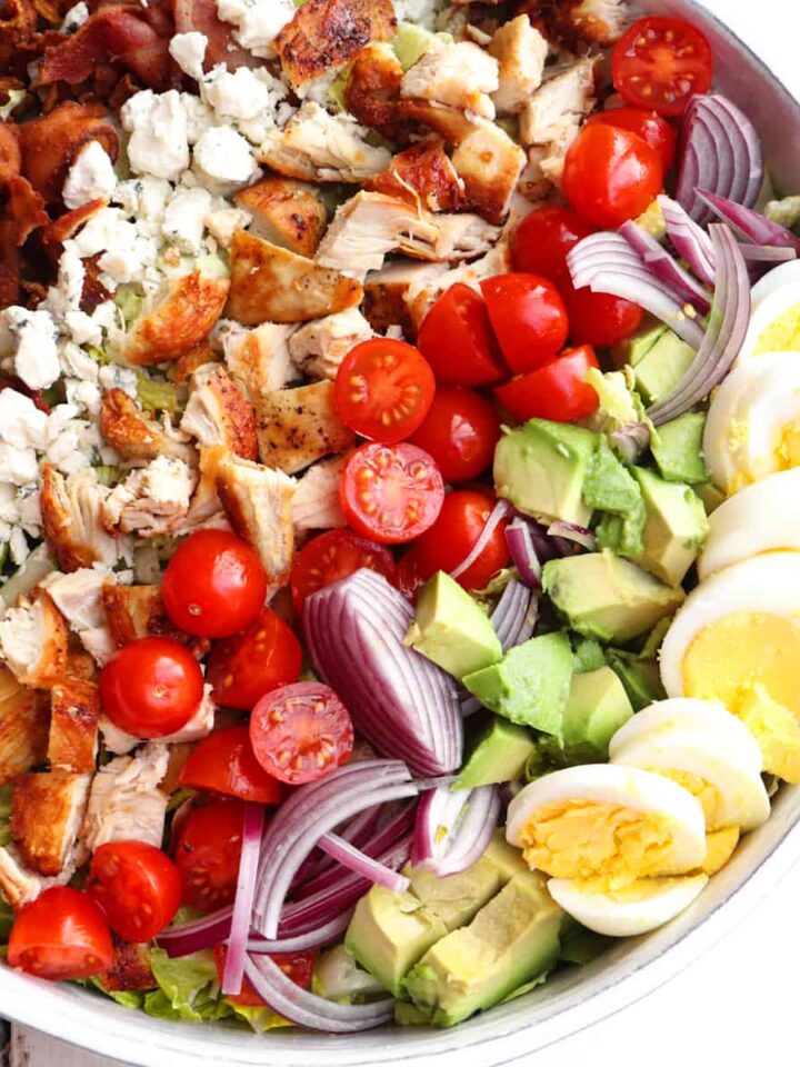 chicken cobb salad arranged in a circular platter