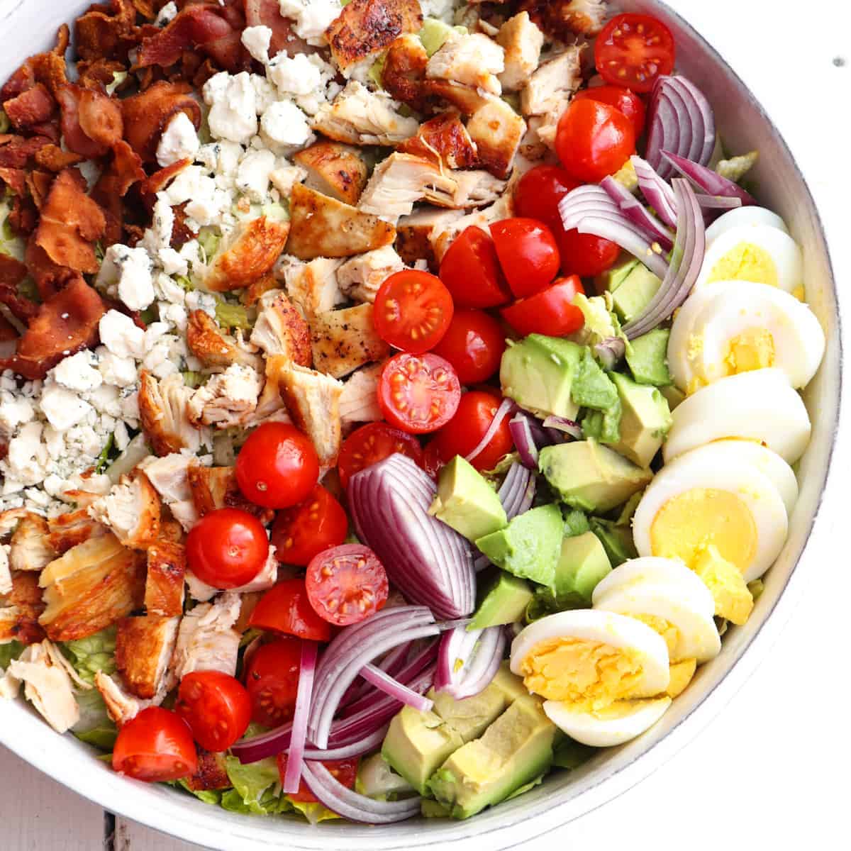 chicken cobb salad arranged in a circular platter