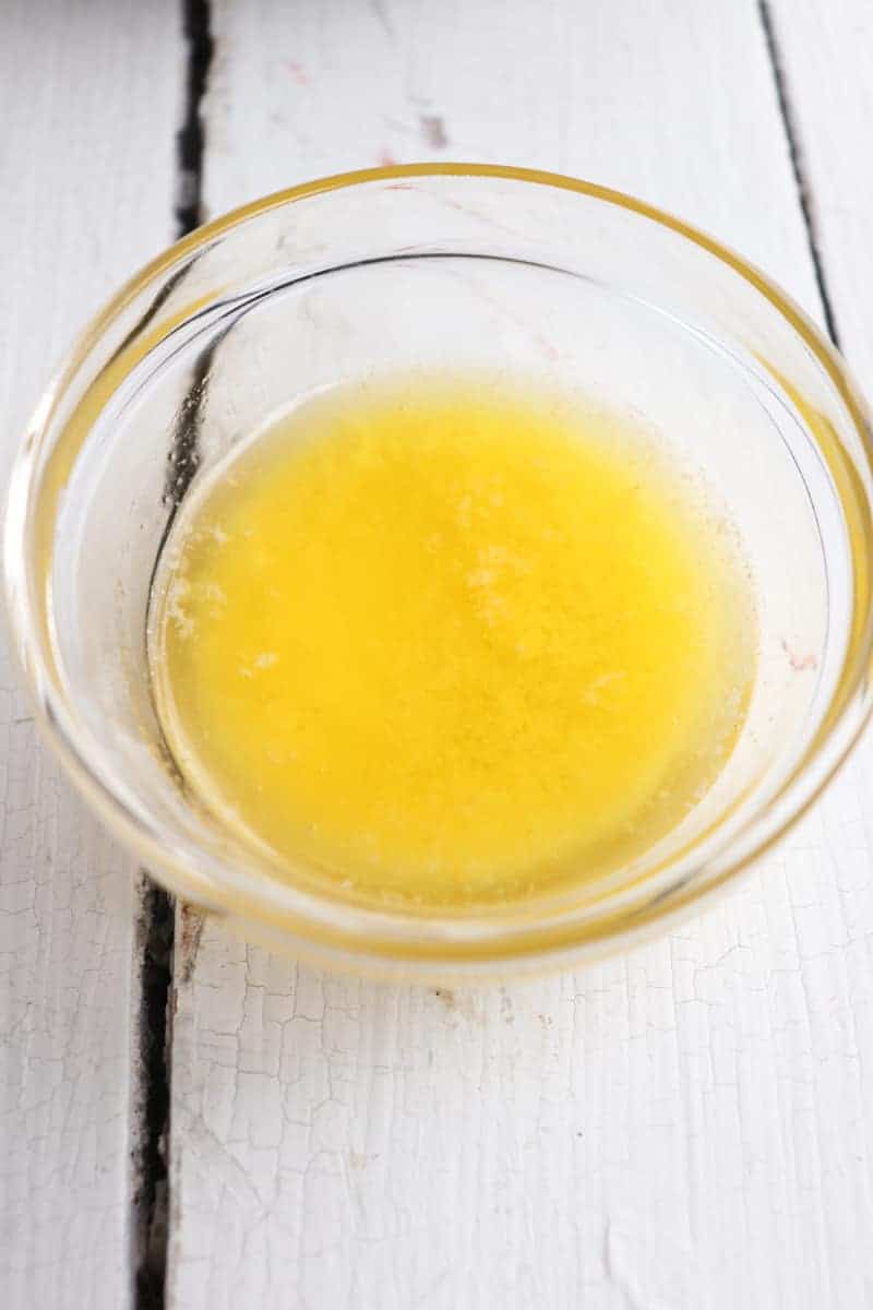 melted butter in a clear glass bowl