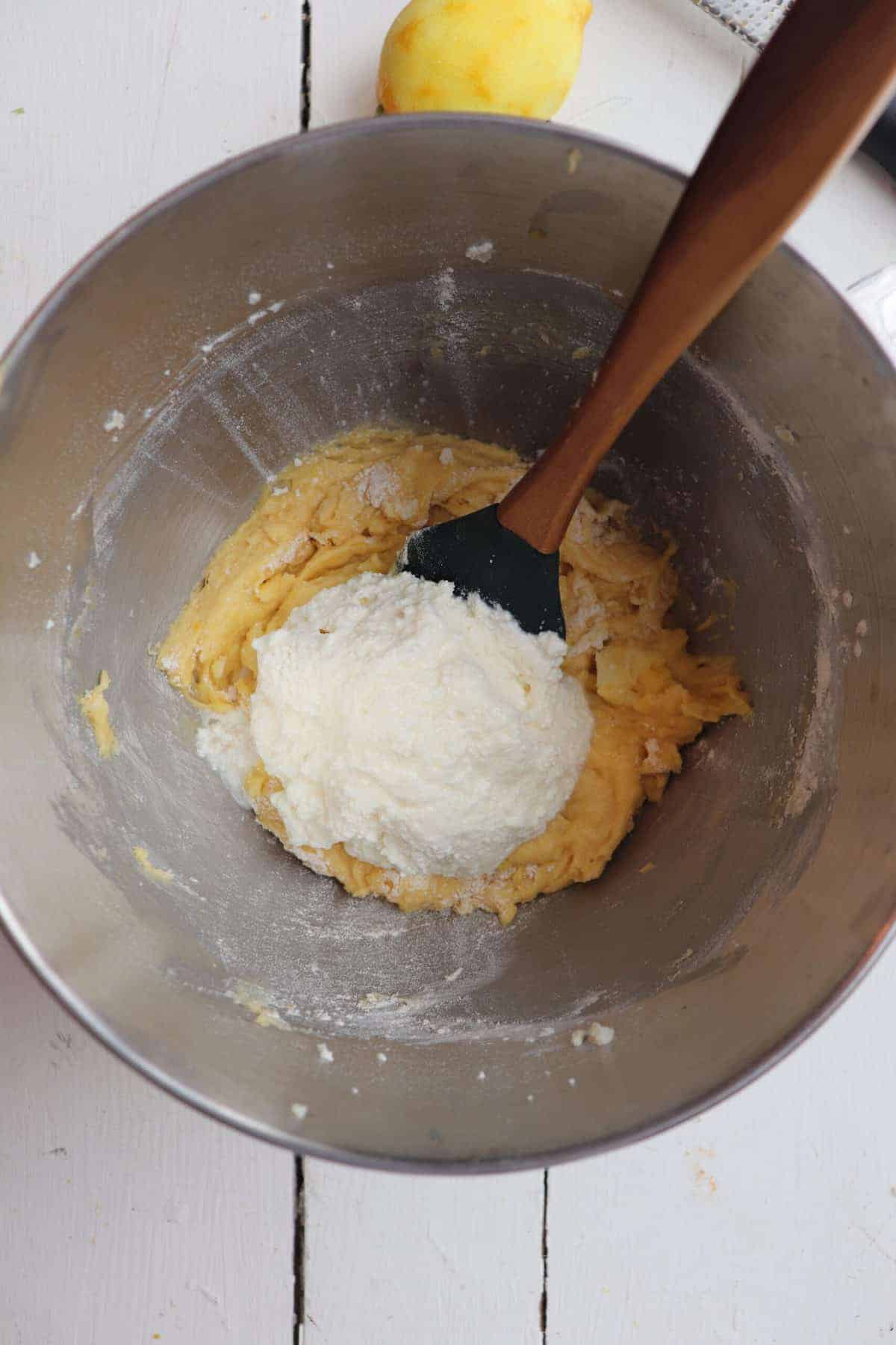 ricotta scooped into batter with spatula
