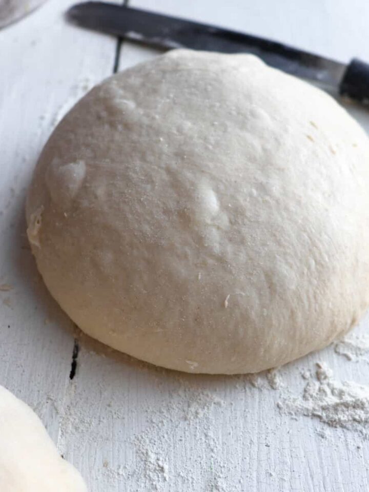 finished sourdough discard pizza dough in a ball