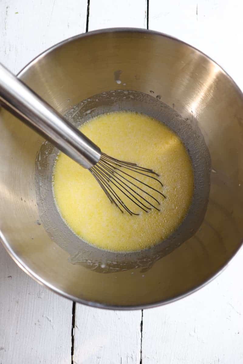 water, oil, and starter combine with a whisk