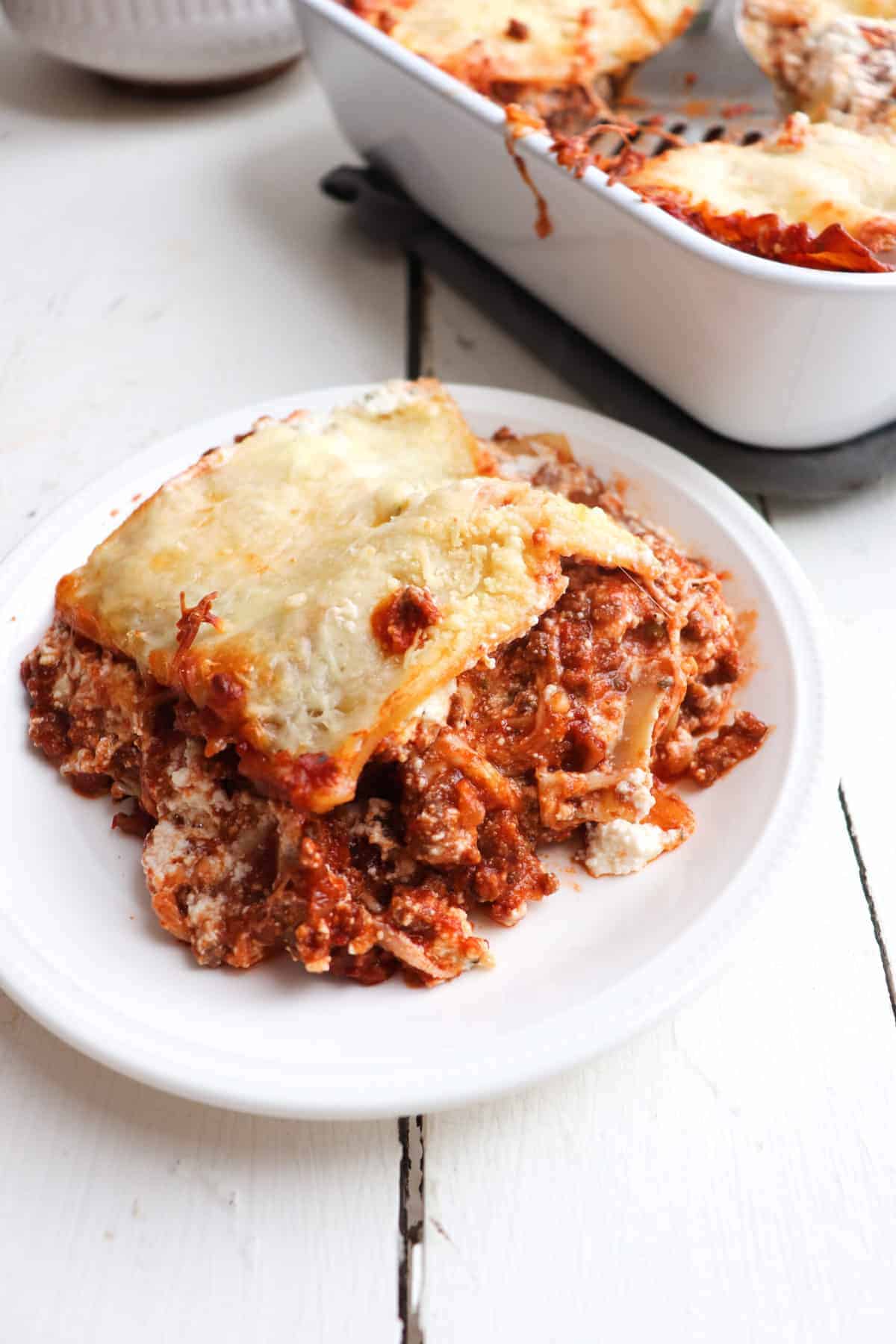 one slice of venison lasagna on a plate.