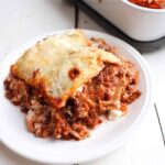 one slice of venison lasagna on a plate.