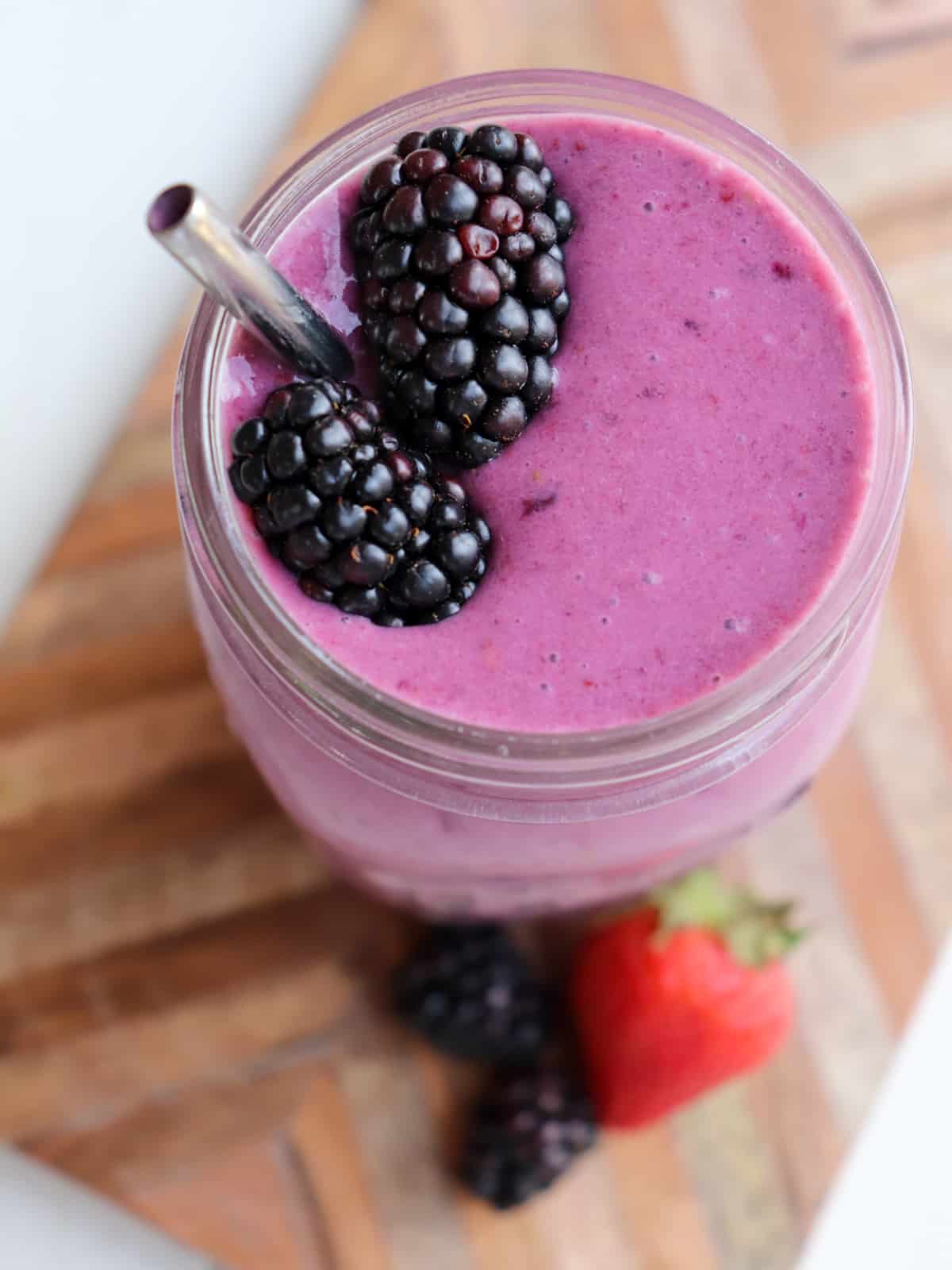 smoothie in a glass with a straw.