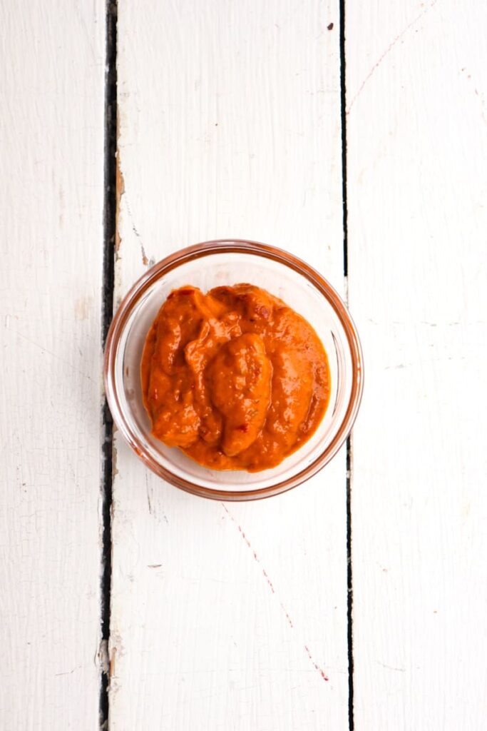 red curry paste in a clear glass bowl