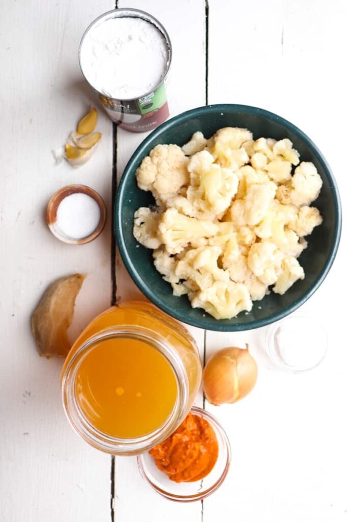 ingredients for spicy cauliflower soup on a white background