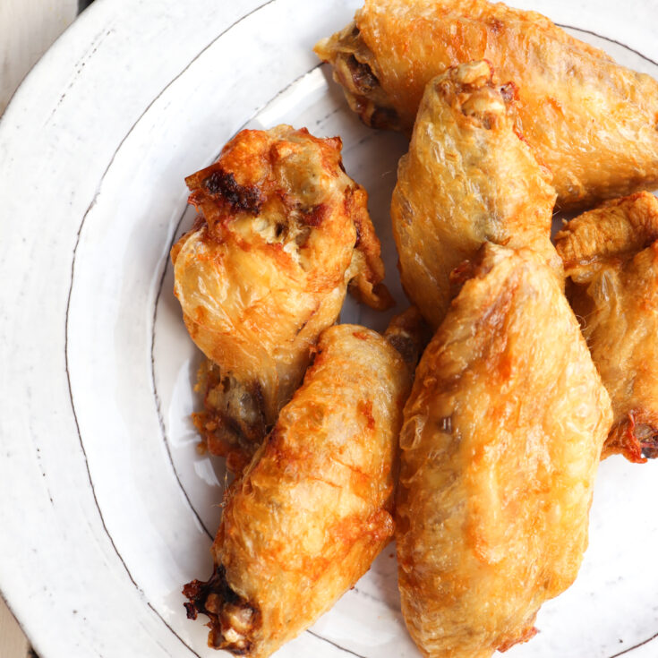 finished crispy wings on a plate.