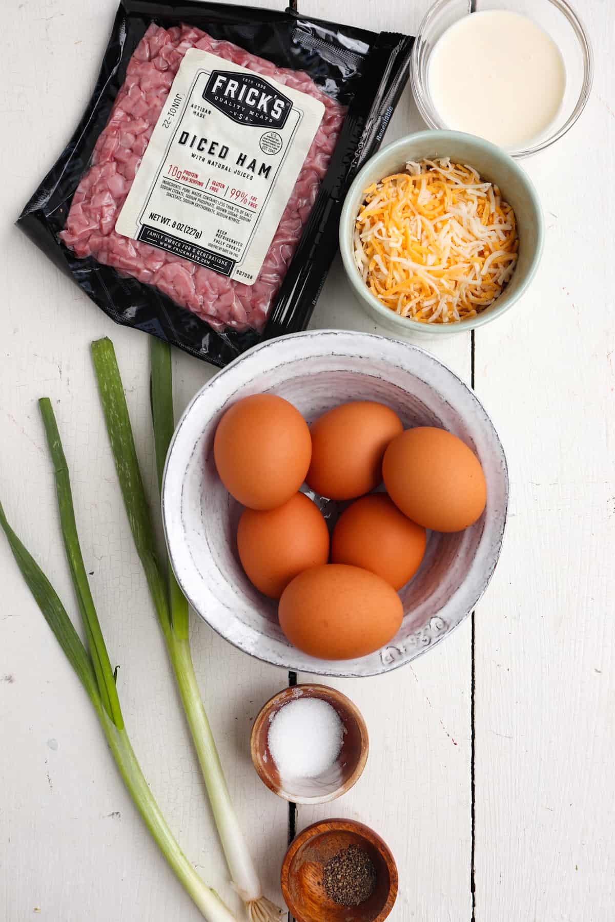 ingredients for air fryer egg bites on a white background.