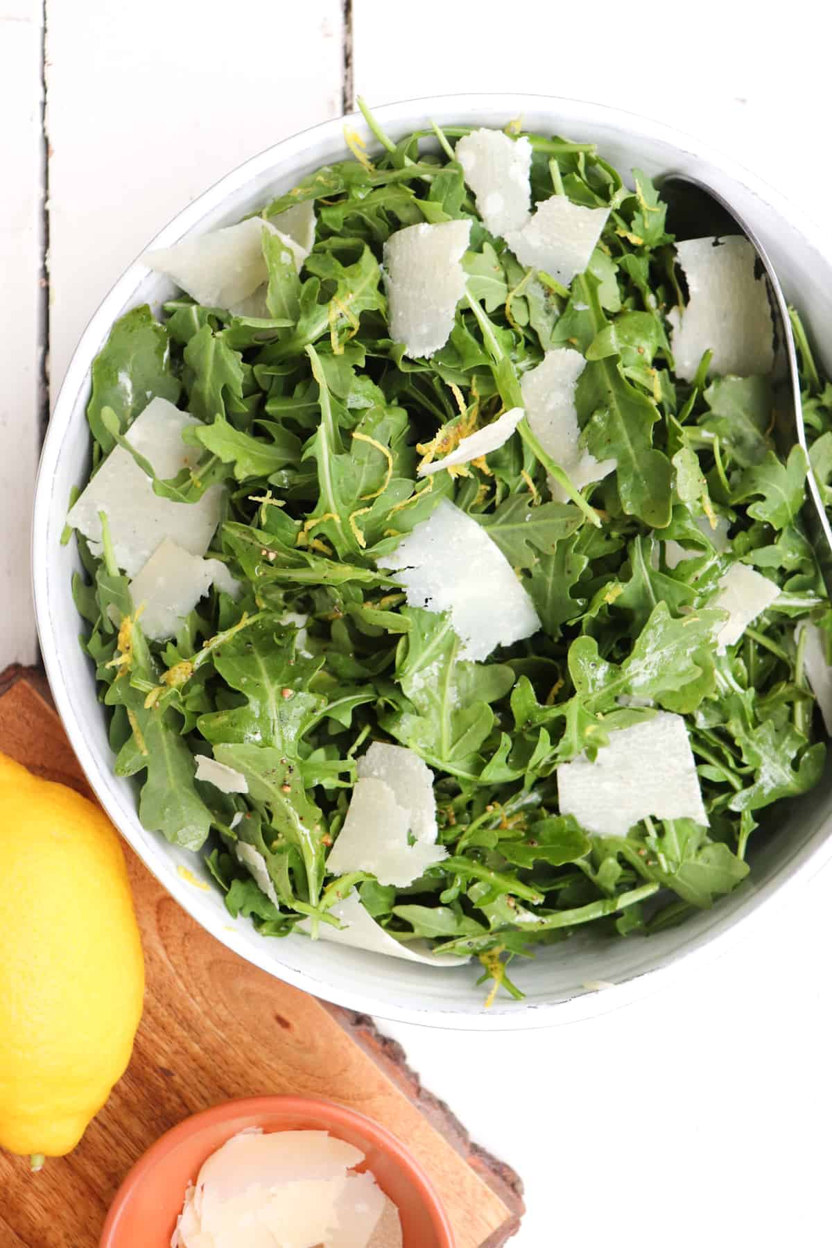 arugula salad in a serving bowl.