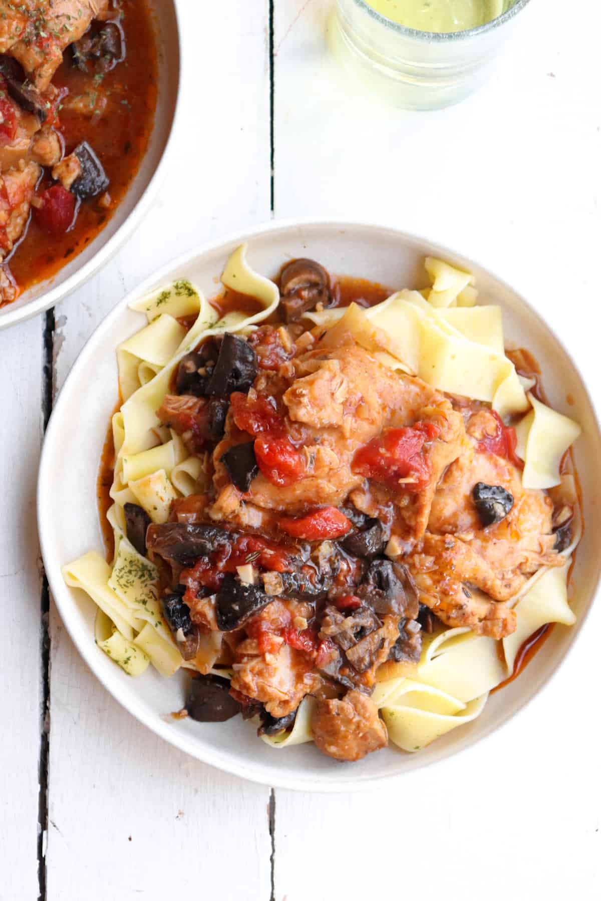 finished chasseur plated on pappardelle noodles.