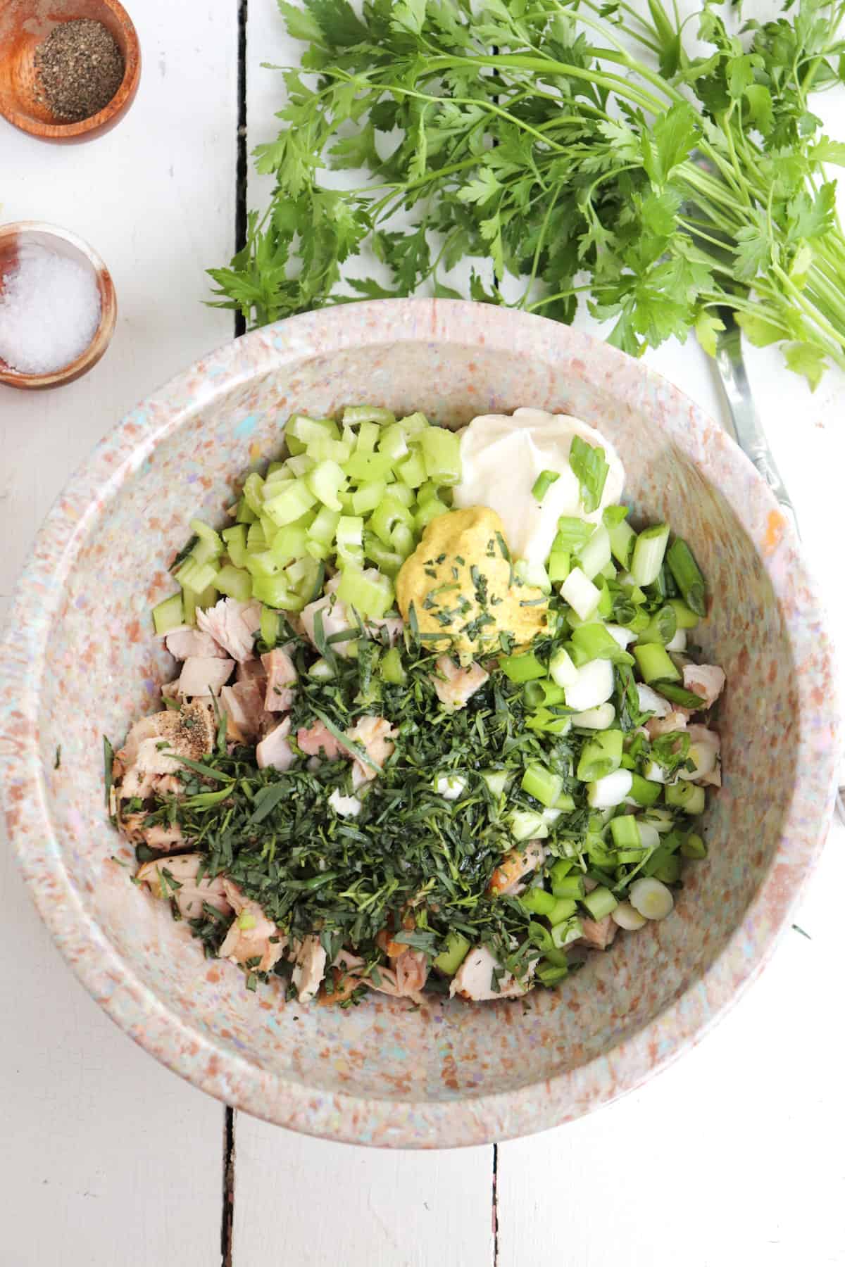 chicken salad in a bowl ready to be mixed.