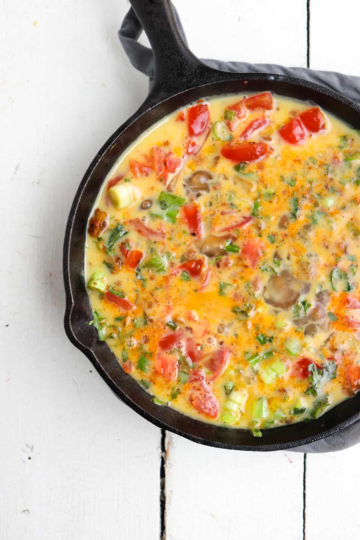 mexican frittata in skillet before cheese has been added.